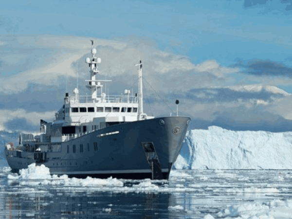 Cost of Antarctica cruise, vessel passing the glaciers