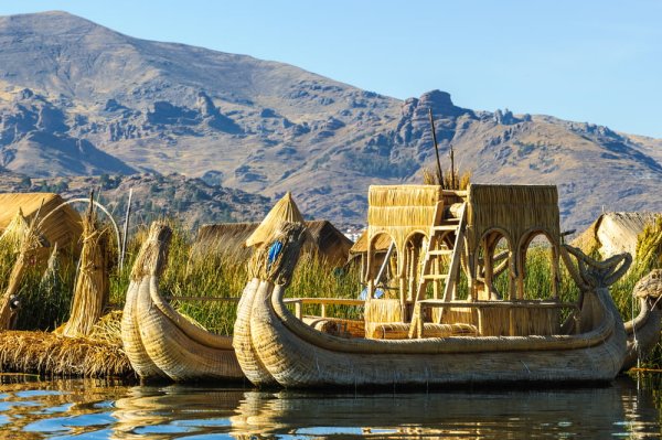 best places to solo travel typical boats in Titicaca lake